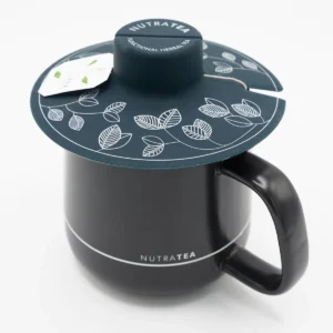 The NutraTea black Tea Buddy sitting on top of a NutraTea branded mug