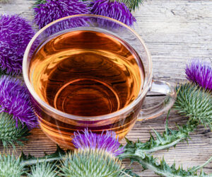 A cup of milk thistle herbal tea offering benefits for the liver